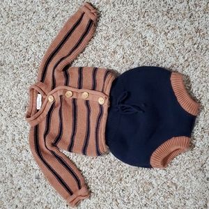 Knit baby outfit.